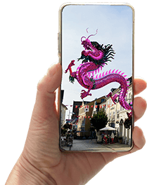 Hand holding smartphone with an Augmented reality experience showing a chinese dragon on a small shopping street.